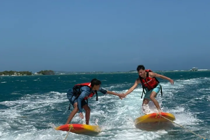 a man riding a wave on a surfboard in the water