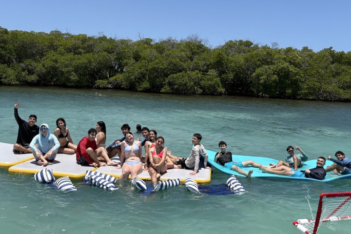 a group of people riding on the back of a boat
